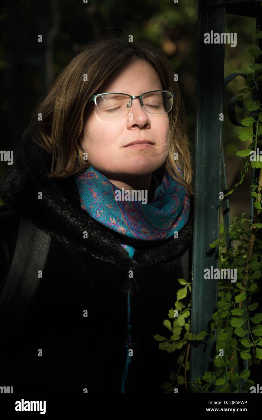 Portrait of an attractive thirty year old white woman with glasses