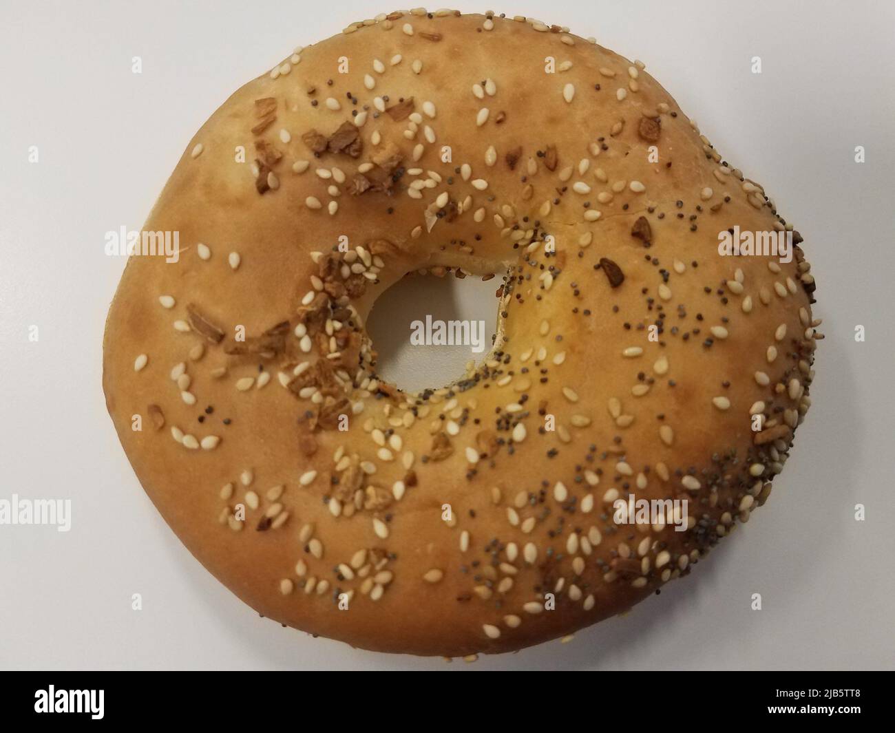 a bagel with onion and sesame seeds and poppy seeds Stock Photo Alamy