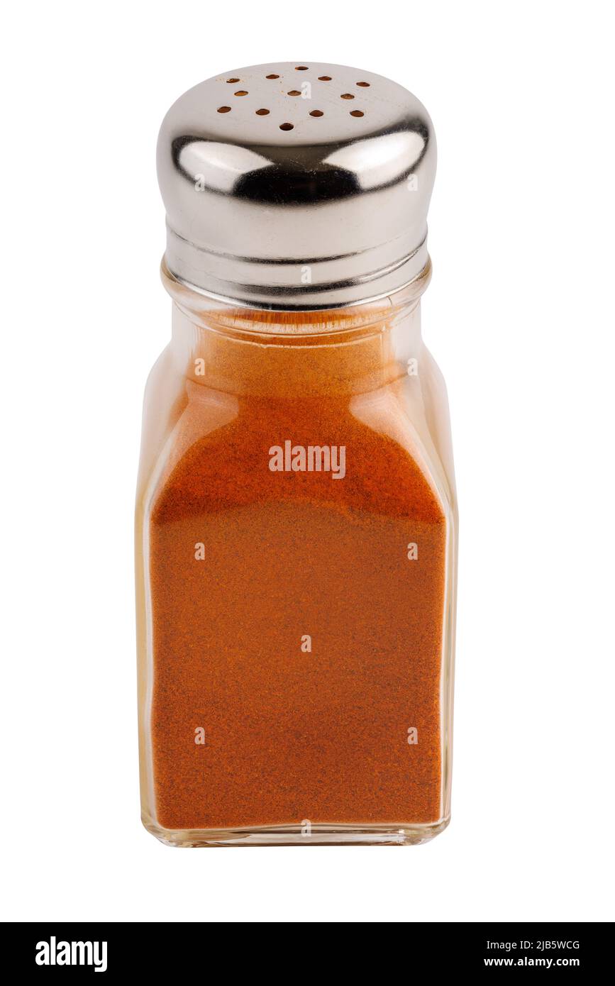 glass pepper pot with ground red paprika pepper isolated on white