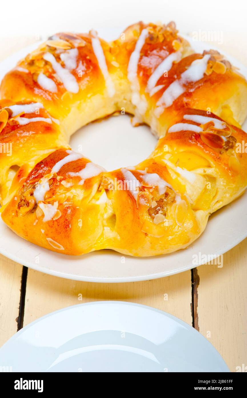 fresh home baked sweet bread donut cake with almonds and icing sugar on top. Stock Photo