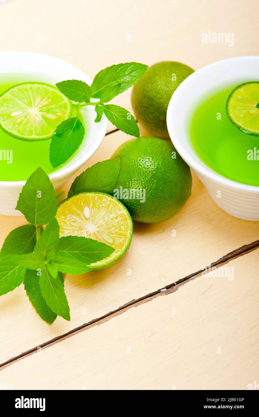 fresh and healthy mint infusion tea tisane with lime. Stock Photo