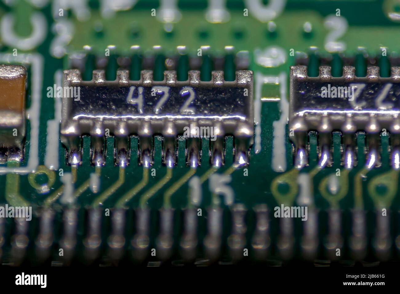 Macrophotography of welds of electronic component integrated circuit in