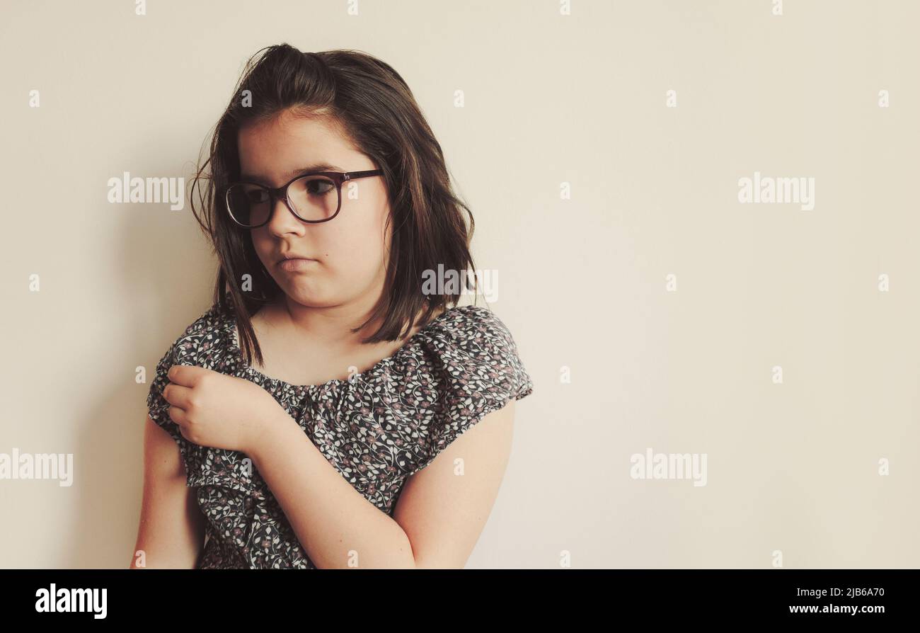 Small girl posing, facial expression. Stock Photo