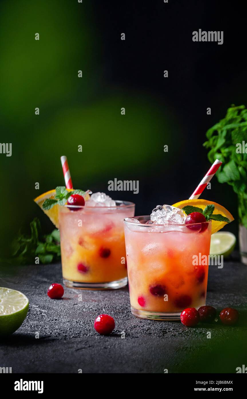 Cocktail with Rum or Vodka, Soda, Cranberry, Orange Juice, Lime and