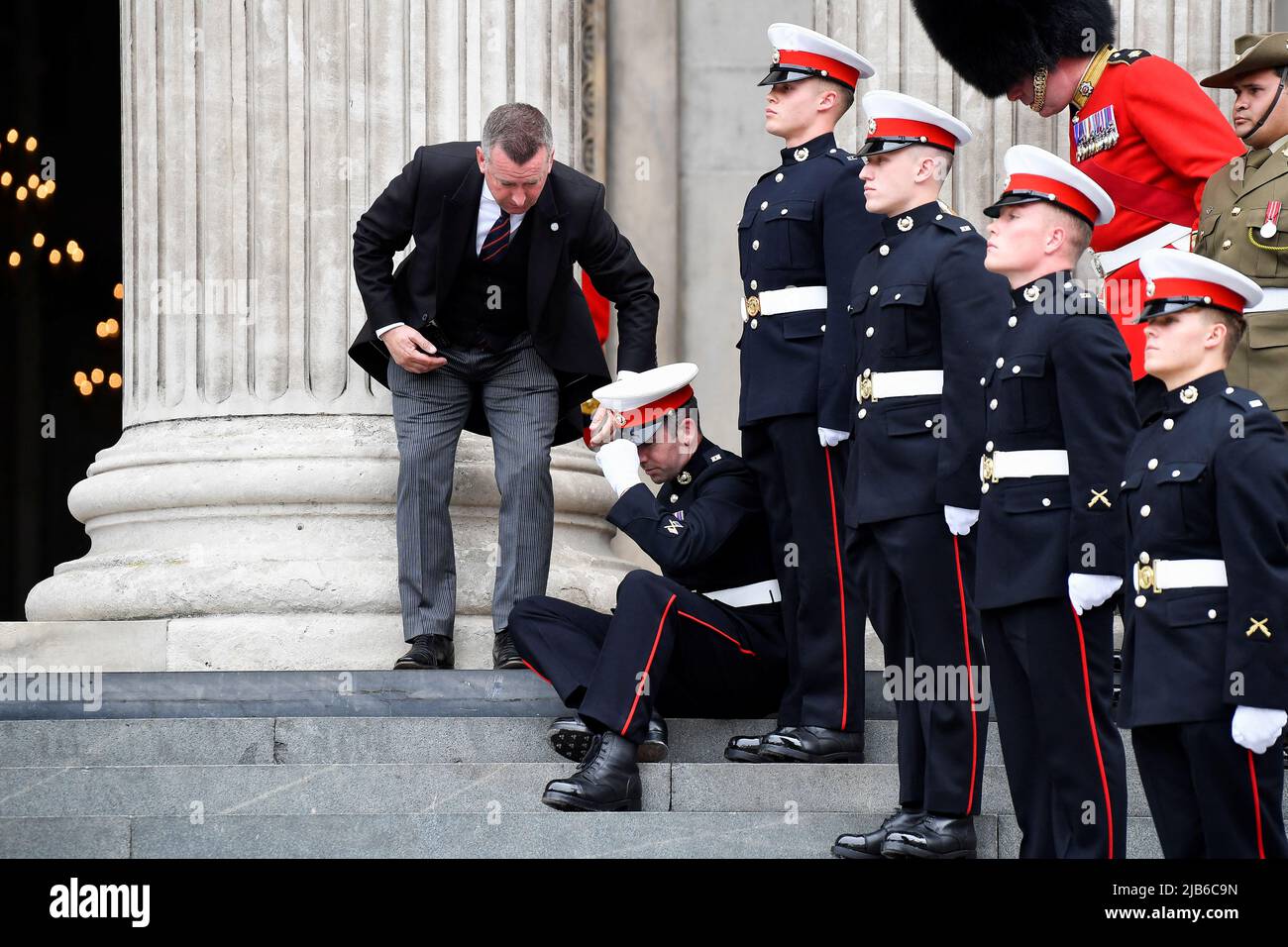 A member of the Ceremonial Guard feels unwell ahead of the National Service of Thanksgiving at St Paul's Cathedral, London, on day two of the Platinum Jubilee celebrations for Queen Elizabeth II. Picture date: Friday June 3, 2022. Stock Photo