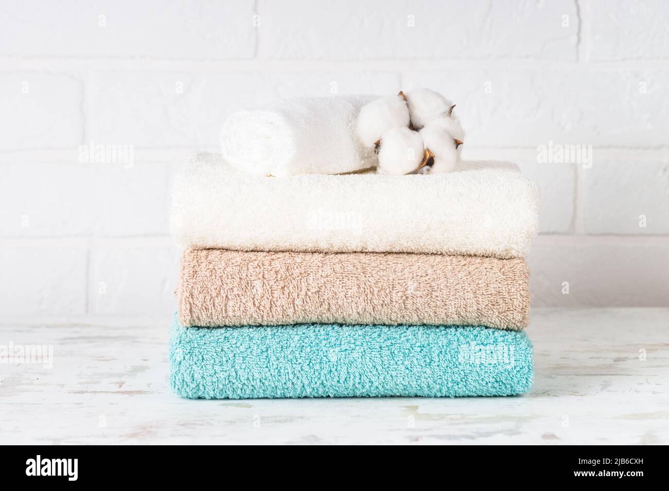 Stack of bath towels in white bathroom Stock Photo Alamy