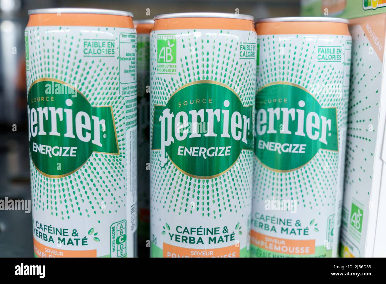 Tyumen, Russia-May 11, 2022: Mineral water bottles Perrier energize cofeine yerba mate. French brand of premium mineral water. Selling in the hypermar Stock Photo