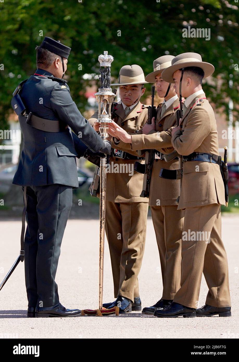 New members of The 1st Battalion, The Royal Gurkha Rifles during Kasam Khane, a ceremonial event during which new Riflemen swear their allegiance to the Regiment by touching the Queen???s Truncheon to cement their oath, during a Queen's Platinum Jubilee parade at Sir John Moore Barracks in Folkestone, Kent. Picture date: Friday June 3, 2022. Stock Photo