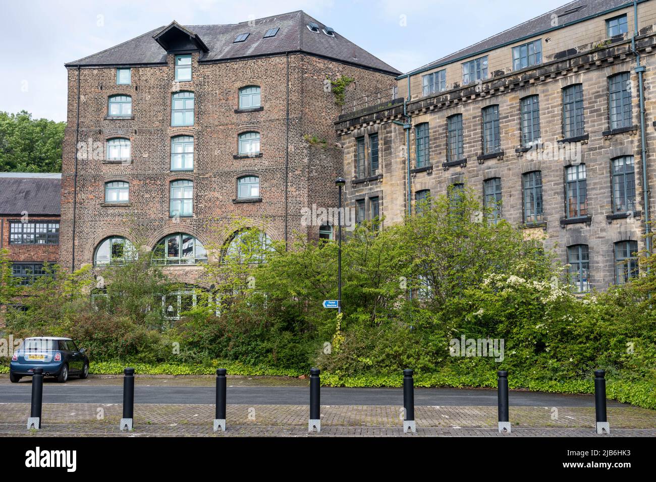 View of the former warehouse buildings of Seven Stories and 36 Lime Street in the Ouseburn cultural quarter, Newcastle upon Tyne, UK. Stock Photo