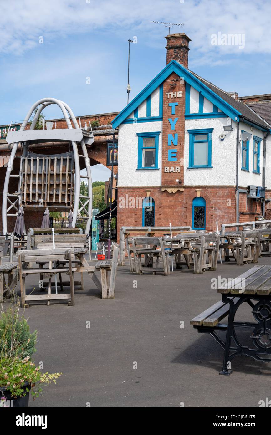 The Tyne bar, a vibrant pub at the eastern end of the Quayside, Newcastle upon Tyne, UK, where the Ouseburn river joins the River Tyne. Stock Photo