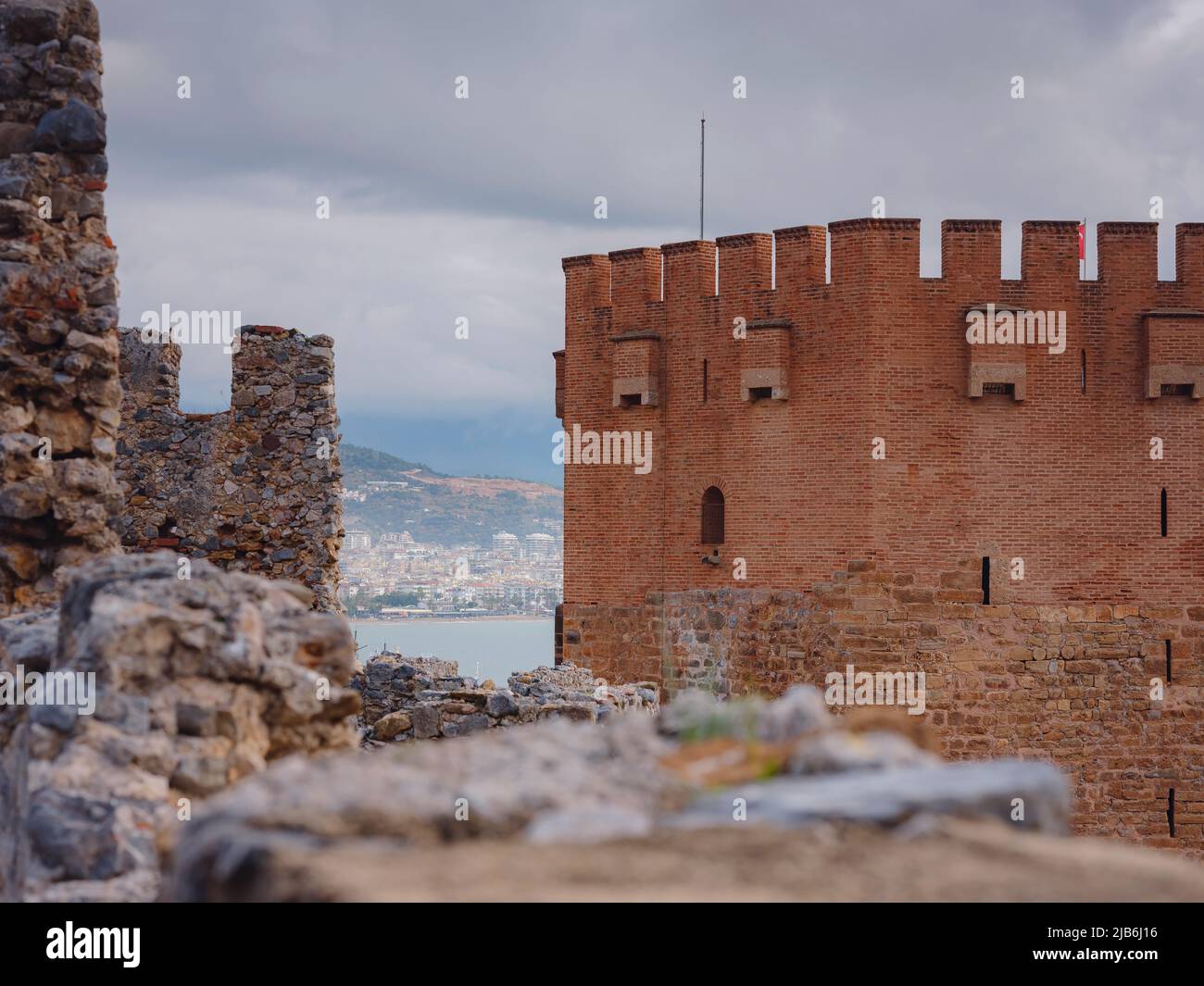 Alanya, turkey, winter walk by mediterranean sea. Kizil Kule tower on