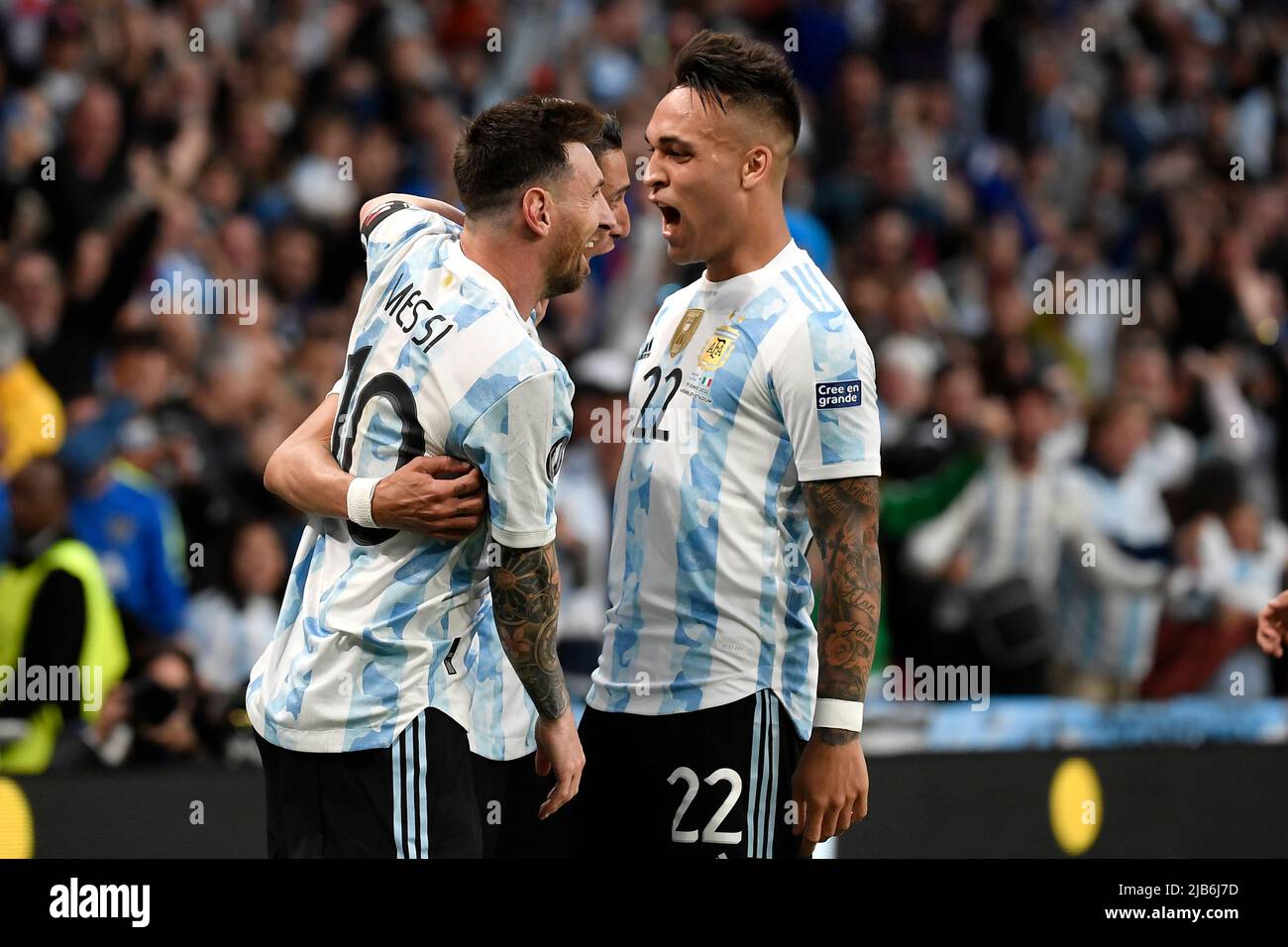 Angel Di Maria of Argentina (c) celebrates with Lionel Messi (l) and Lautaro Martinez (r) after scoring the goal of 0-2 during the Finalissima trophy Stock Photo