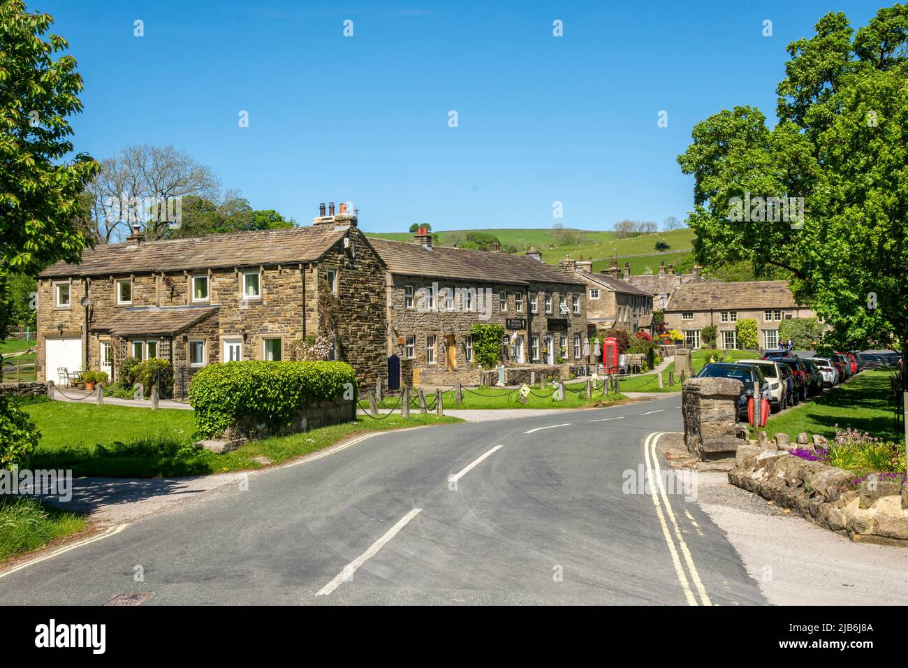 Burnsall is a village and civil parish in the Craven district of North Yorkshire, England. It is situated on the River Wharfe in Wharfedale, and is in Stock Photo