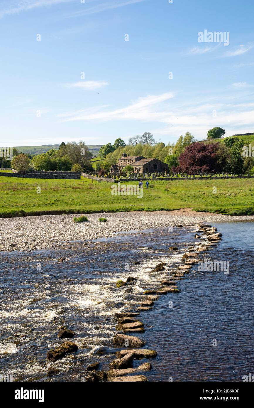 Stepping stones over the River Wharfe, to The Parish Church of St. Michael and All Angels, Linton, The Diocese of West Yorkshire and The Dales Yorkshi Stock Photo
