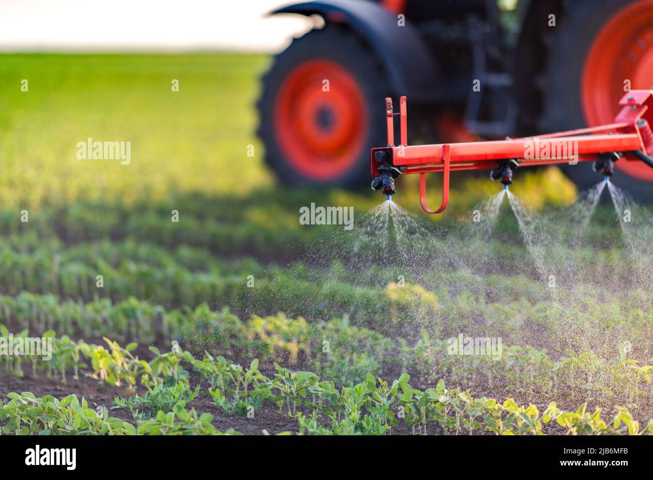 Nozzle of the tractor sprinklers sprayed.Soybean spraying. Stock Photo