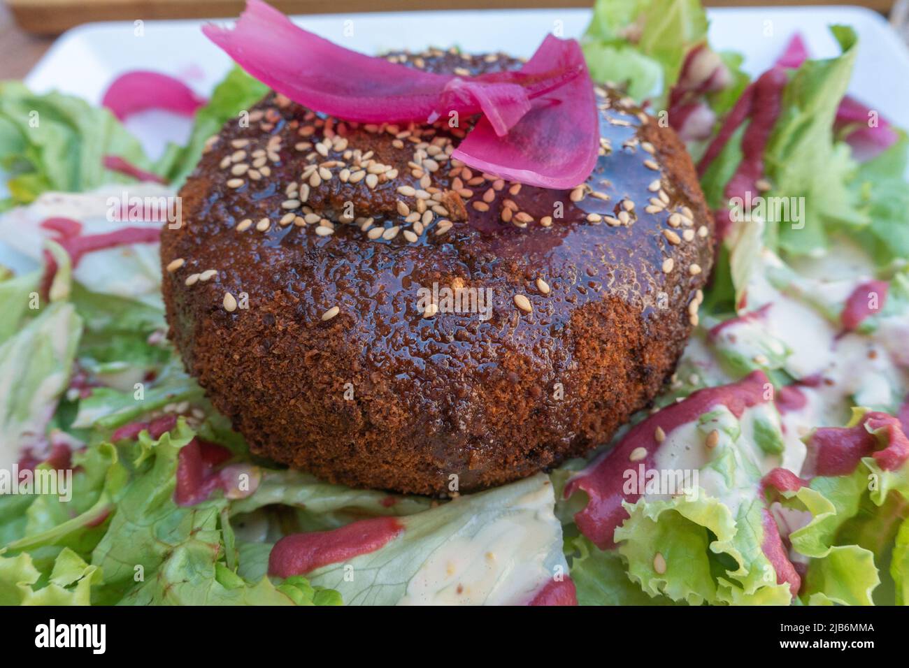 French Camembert baked in walnuts served with a salad Stock Photo