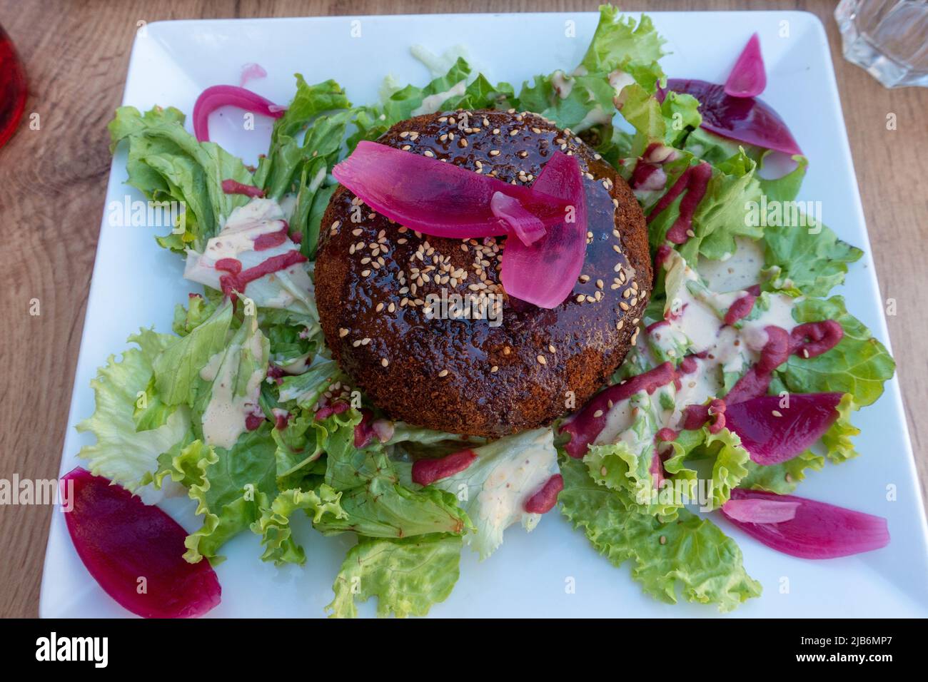 French Camembert baked in walnuts served with a salad Stock Photo Alamy