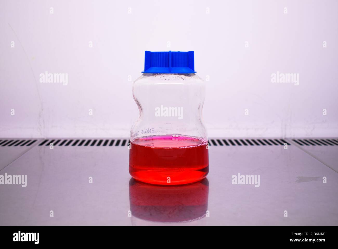 Cell medium bottle in a hepa filter cabin at the cell culture