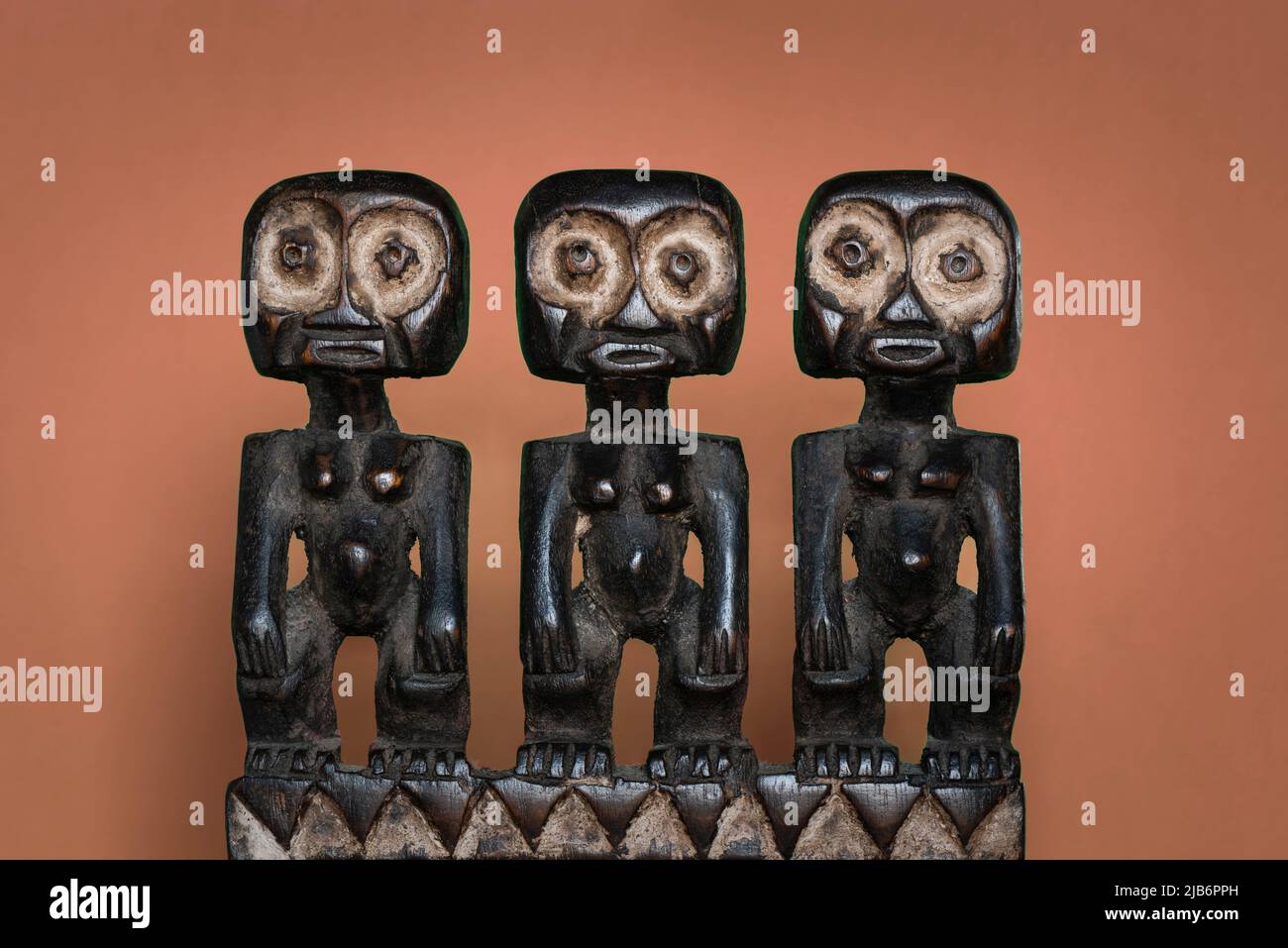 African tribal wooden craft human figures. Fertility symbol. Decorative South African creation. Stock Photo