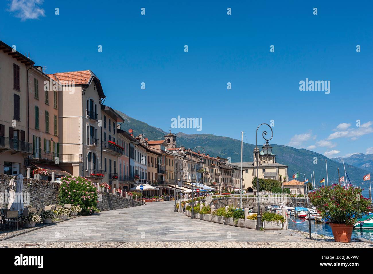 Promenade with historic house facades, in the background the Santuario della SS Pieta pilgrimage church, Cannobio Piedmont, Italy, Europe Stock Photo