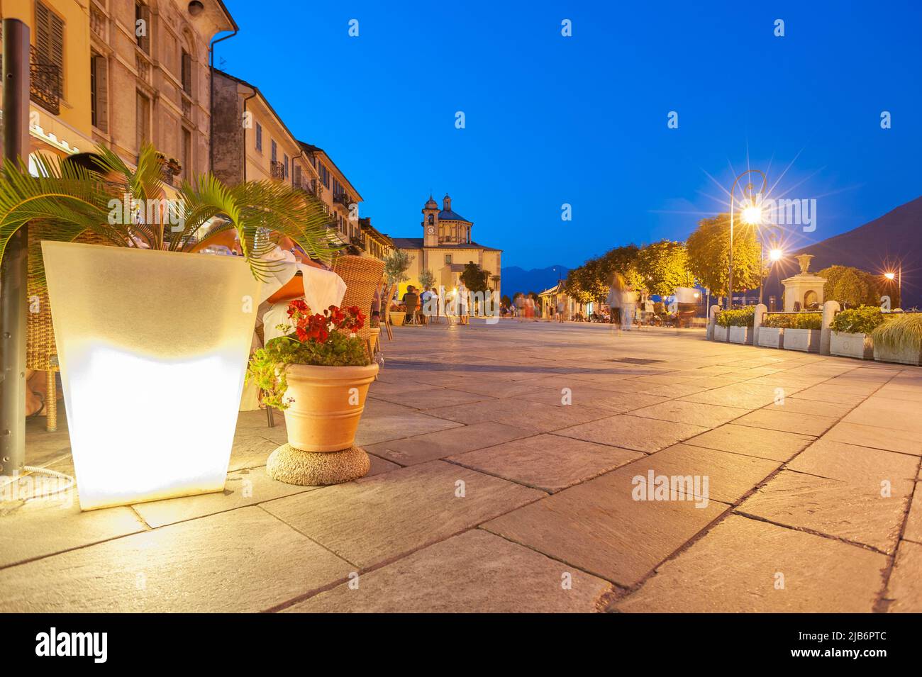 Promenade with historic house facades, in the background the Santuario della SS Pieta pilgrimage church, Cannobio Piedmont, Italy, Europe Stock Photo