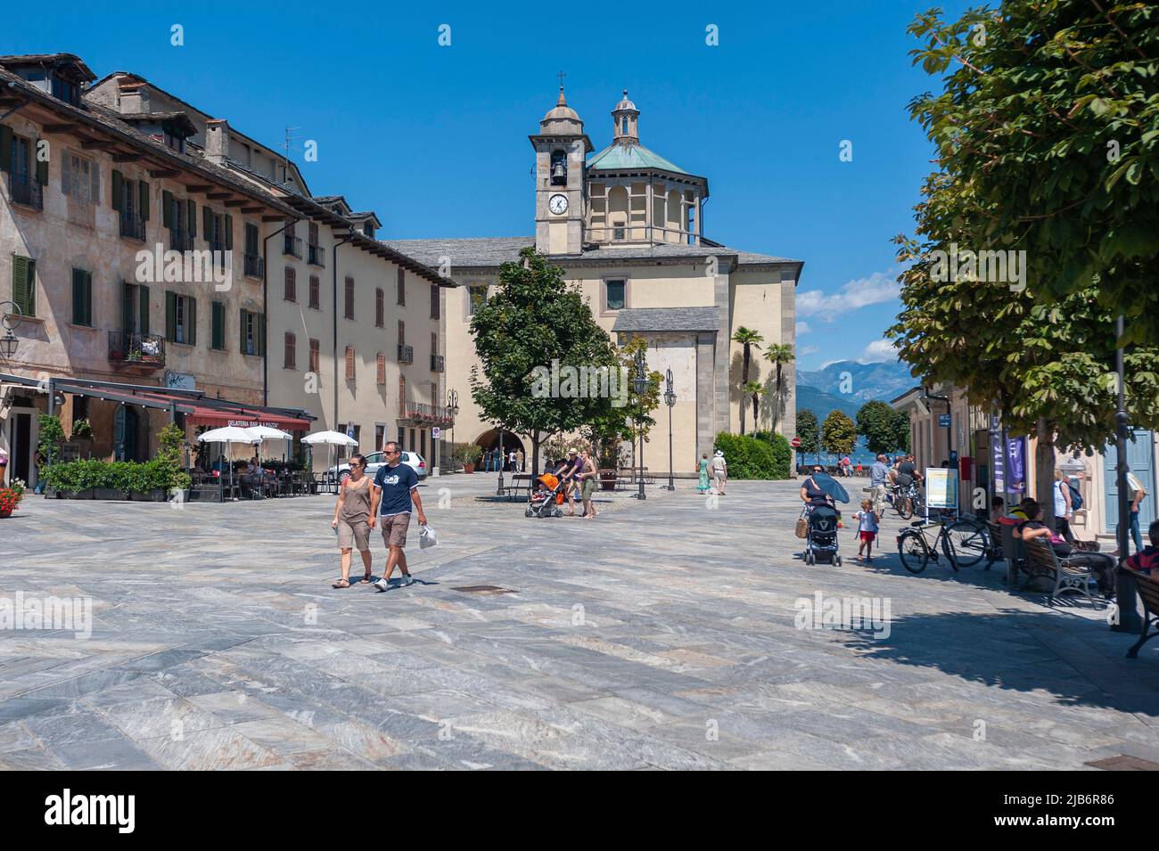 Promenade with historic house facades, in the background the Santuario della SS Pieta pilgrimage church, Cannobio Piedmont, Italy, Europe Stock Photo