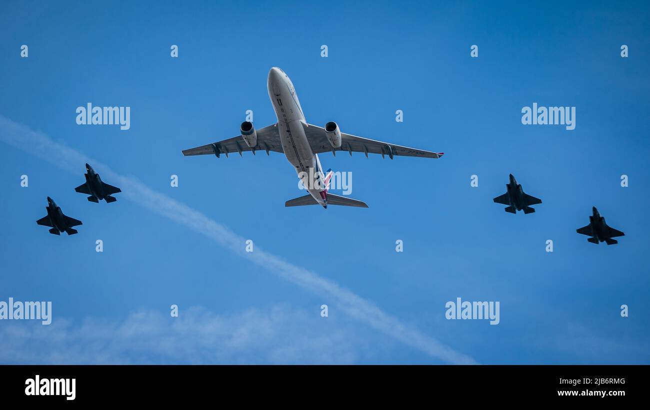 Commercial airline and fighter jets at the flypast in London for the Platinum Jubilee. Stock Photo