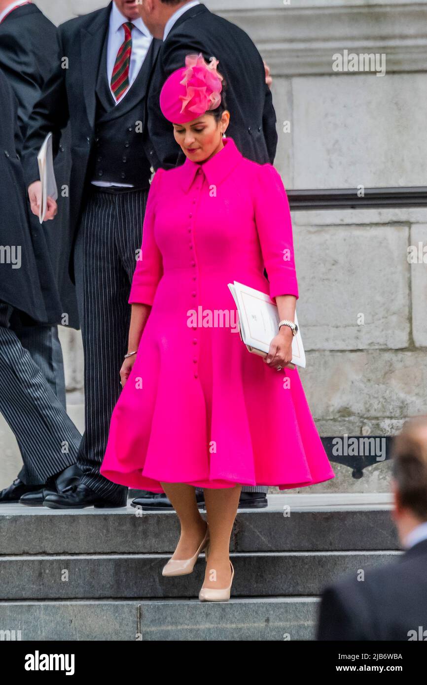 priti patel pink dress London, UK. 3rd June, 2022. Priti Patel, home secretary, leaves, next to Ben Wallace looking slightly awkward