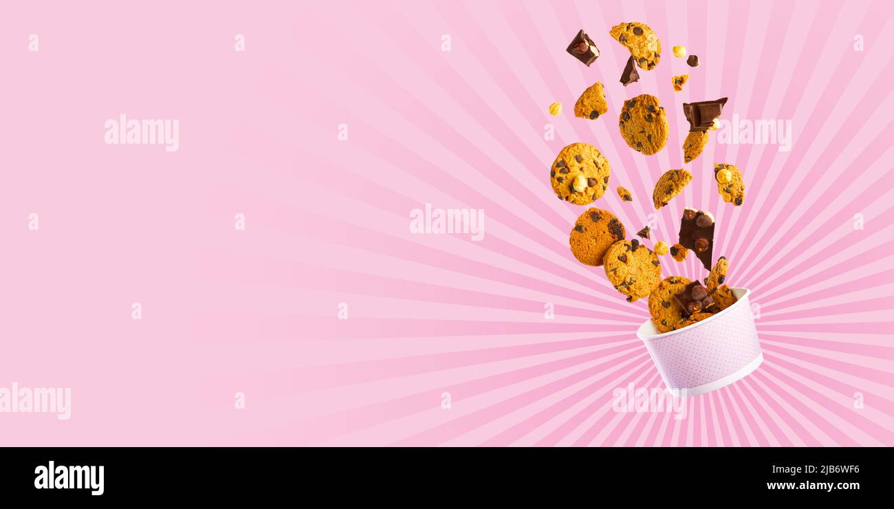 Cookies levitation. falling cookies. Cookies broken in pieces with crumbs. Stock Photo