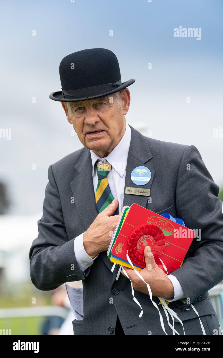 Steward in a Bowler Hat at the Great Yorkshire Show showing their livestock at the 2021 show, Harrogate, North Yorkshire, UK. Stock Photo