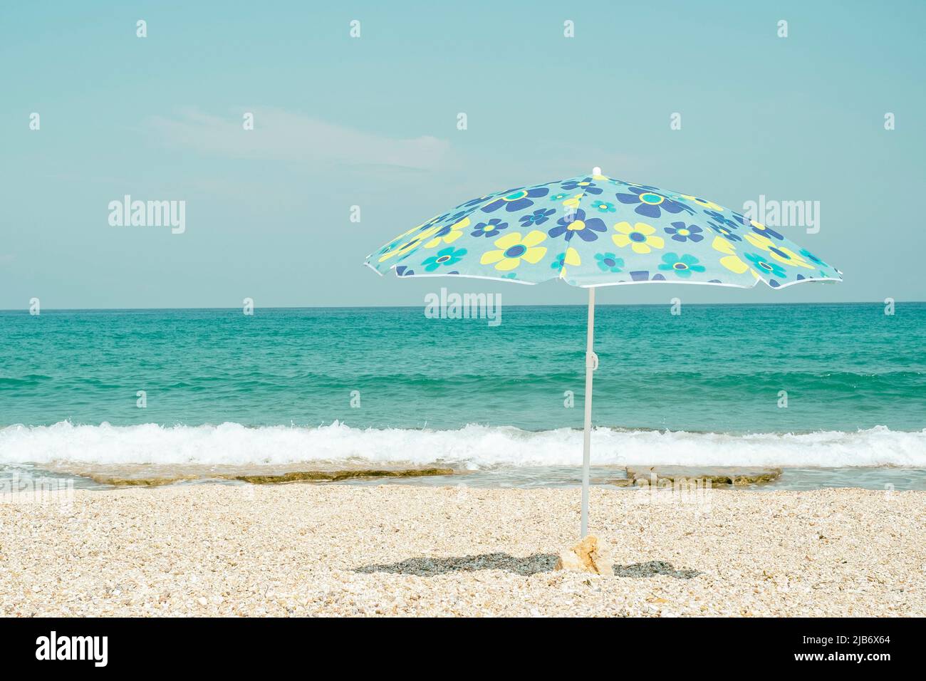 Sun umbrella on the beach Stock Photo - Alamy