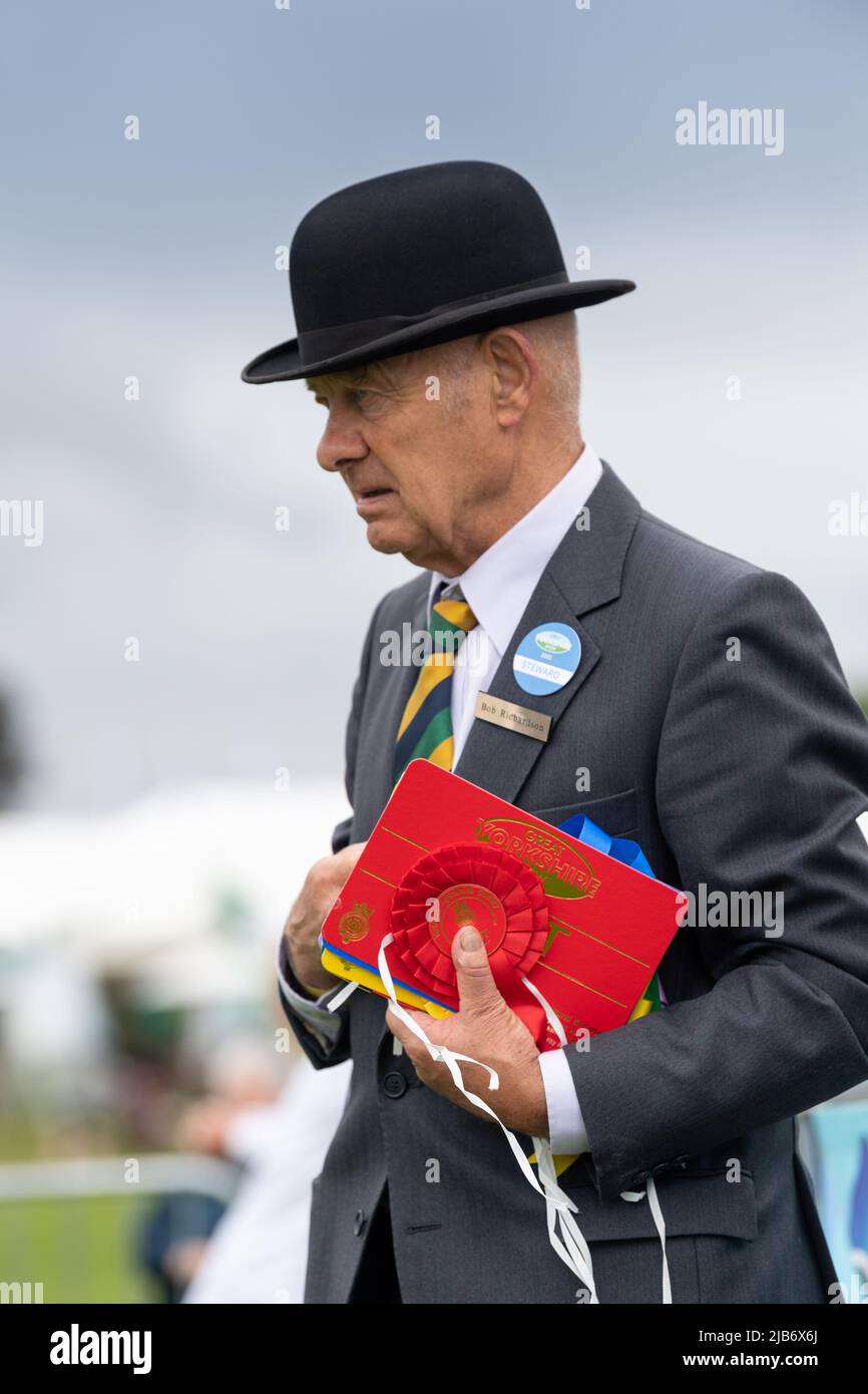 Steward in a Bowler Hat at the Great Yorkshire Show showing their livestock at the 2021 show, Harrogate, North Yorkshire, UK. Stock Photo