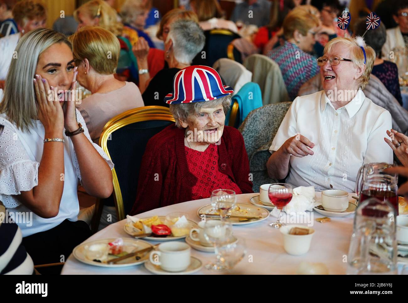 People attend a Queen's Platinum Jubilee Tea Dance at Belfast City Hall, Northern Ireland, as