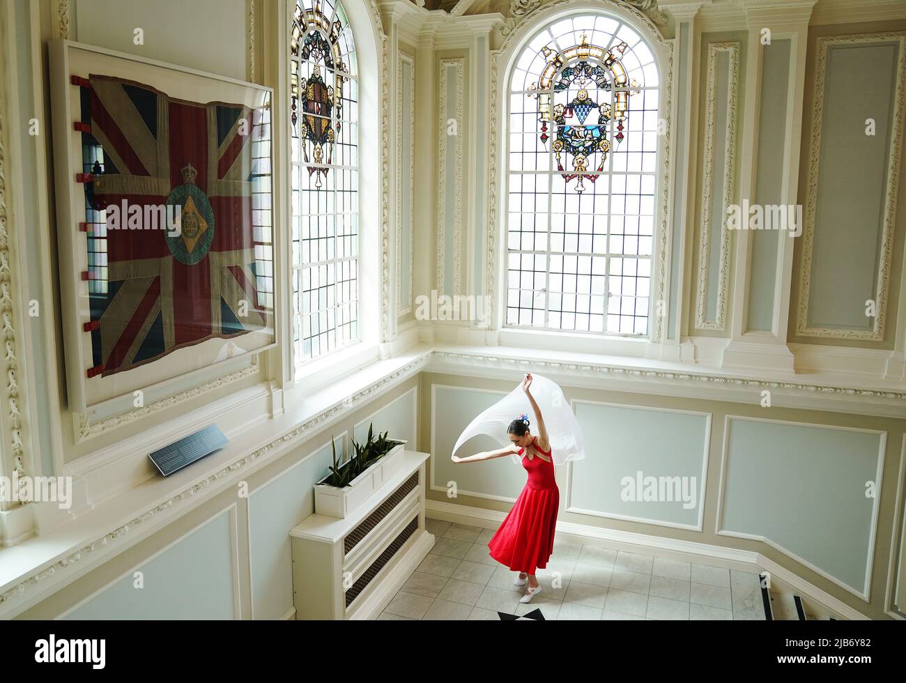 Ballet dancer Miah Ng warms up ahead of her performance at a Queen's Platinum Jubilee Tea Dance