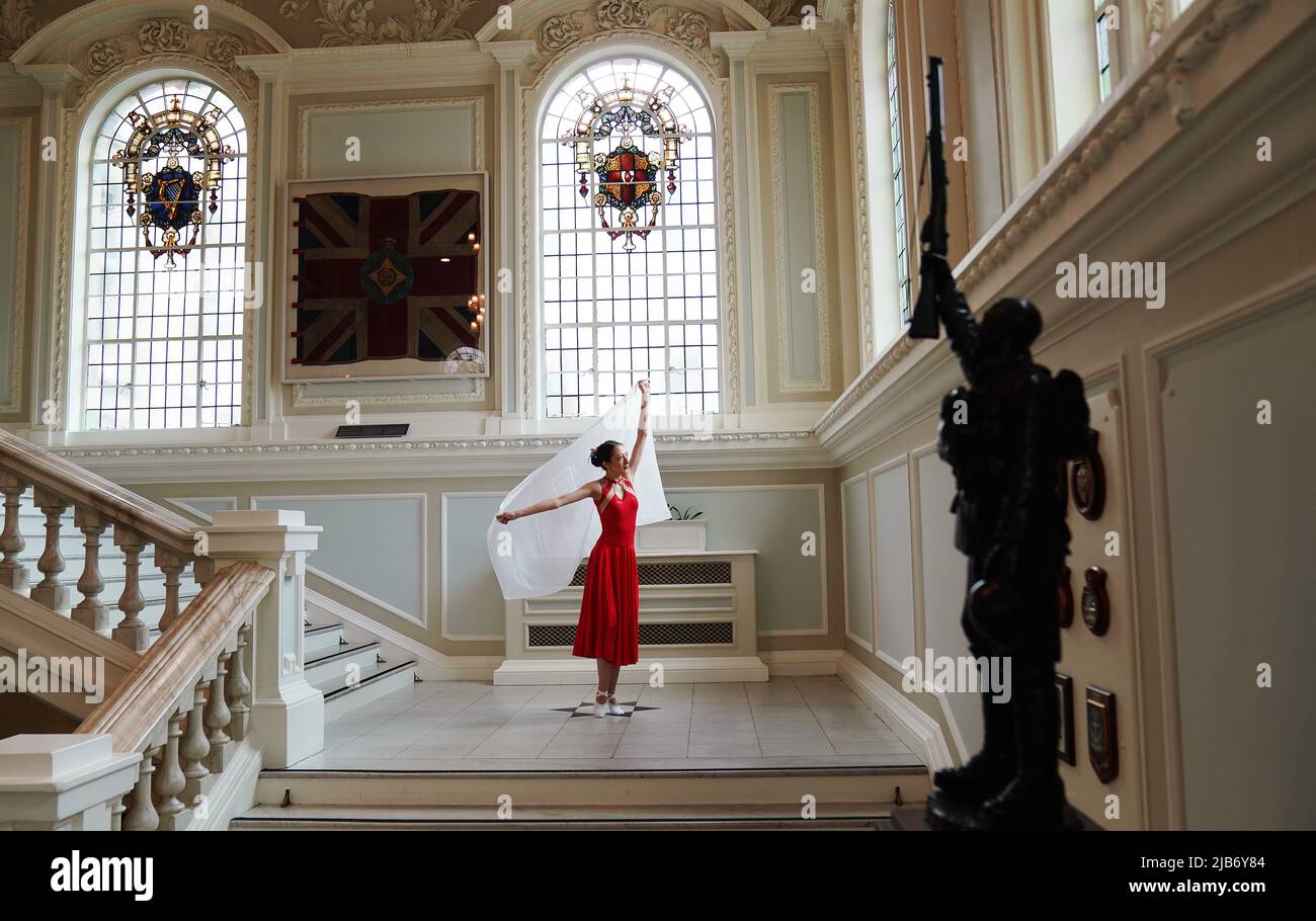 Ballet dancer Miah Ng warms up ahead of her performance at a Queen's Platinum Jubilee Tea Dance