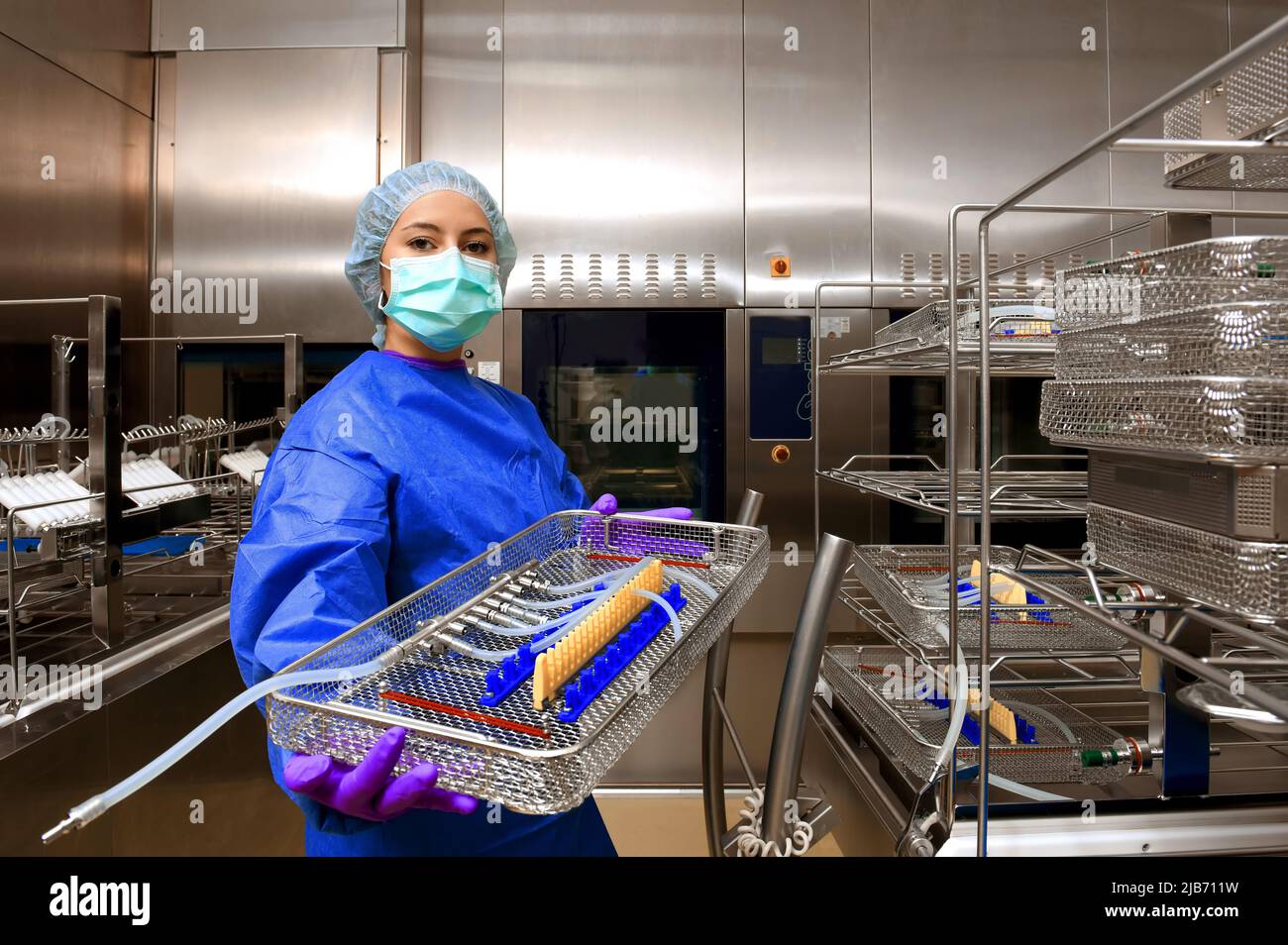 A girl works in a hospital as a medical hygiene worker. Dressed in