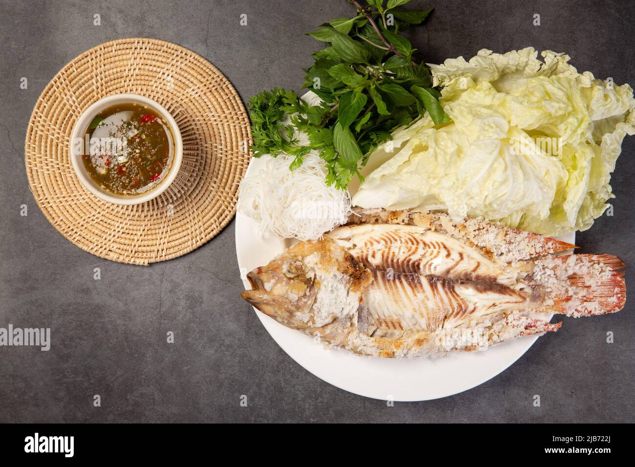 Grilled tilapia with salt and seafood sauce Stock Photo Alamy