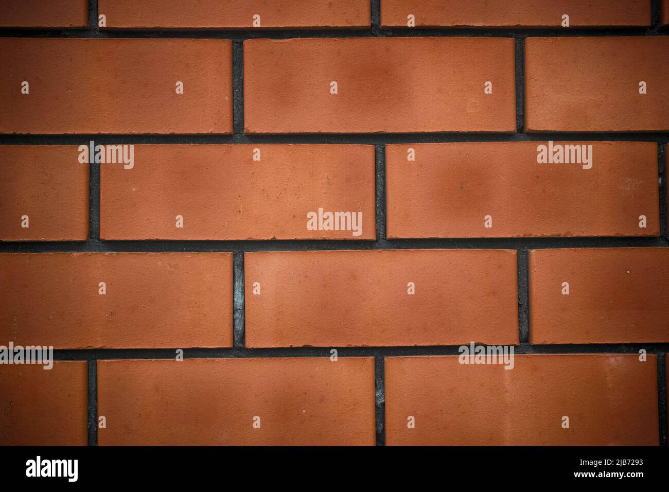 A red brick wall background. Close up. Stock Photo