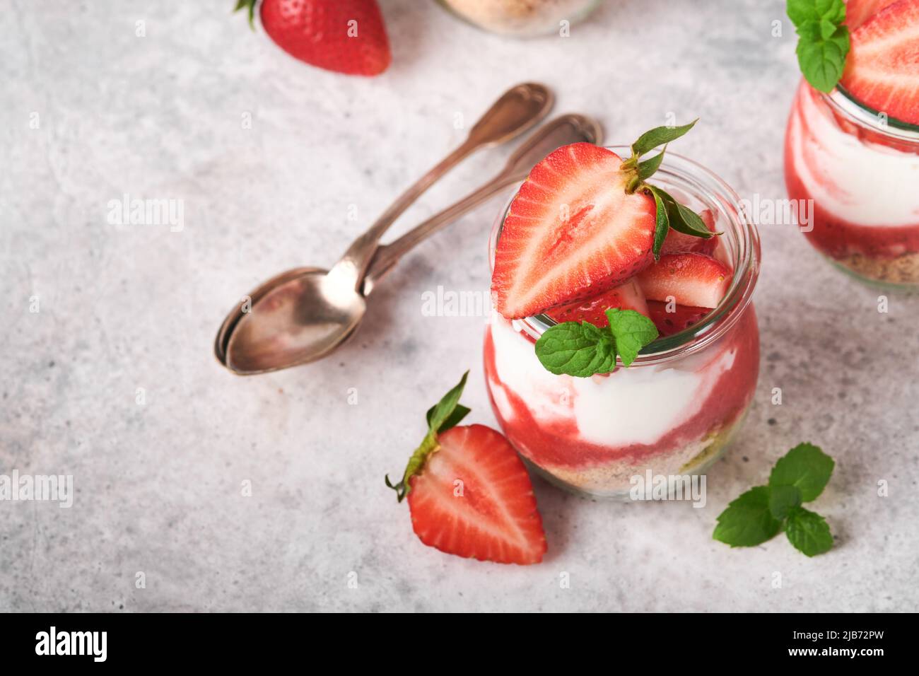 Strawberry Cheesecake. Cheesecake or trifle with strawberry in glass on ...