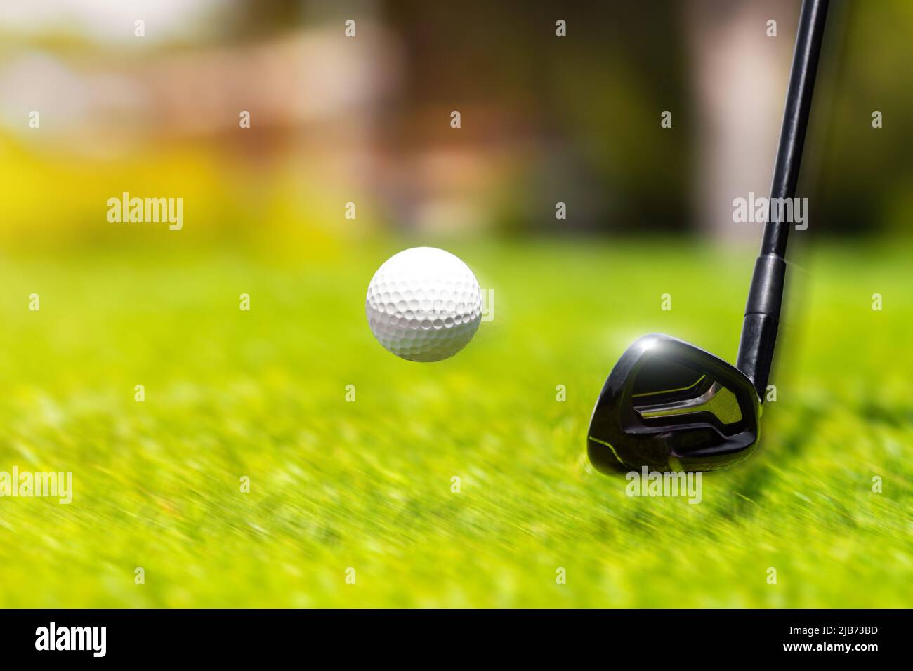 Closeup of hitting golf ball with golf iron club golf course wih motion  blur effect Stock Photo - Alamy