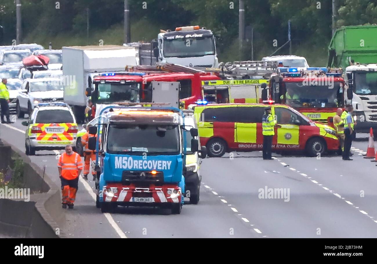 Emergency service personnel along with forensic collision investigators attending the scene of a serious collision on the M50 motorway northbound in Dublin on Friday. Stock Photo