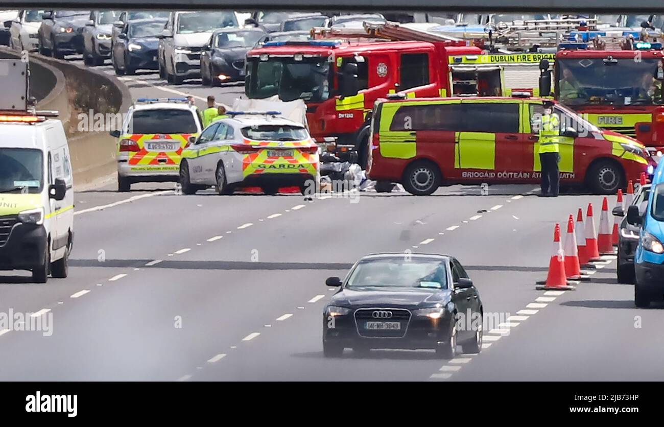 Emergency service personnel along with forensic collision investigators attend the scene of a serious collision on the M50 motorway northbound in Dublin on Friday. Stock Photo