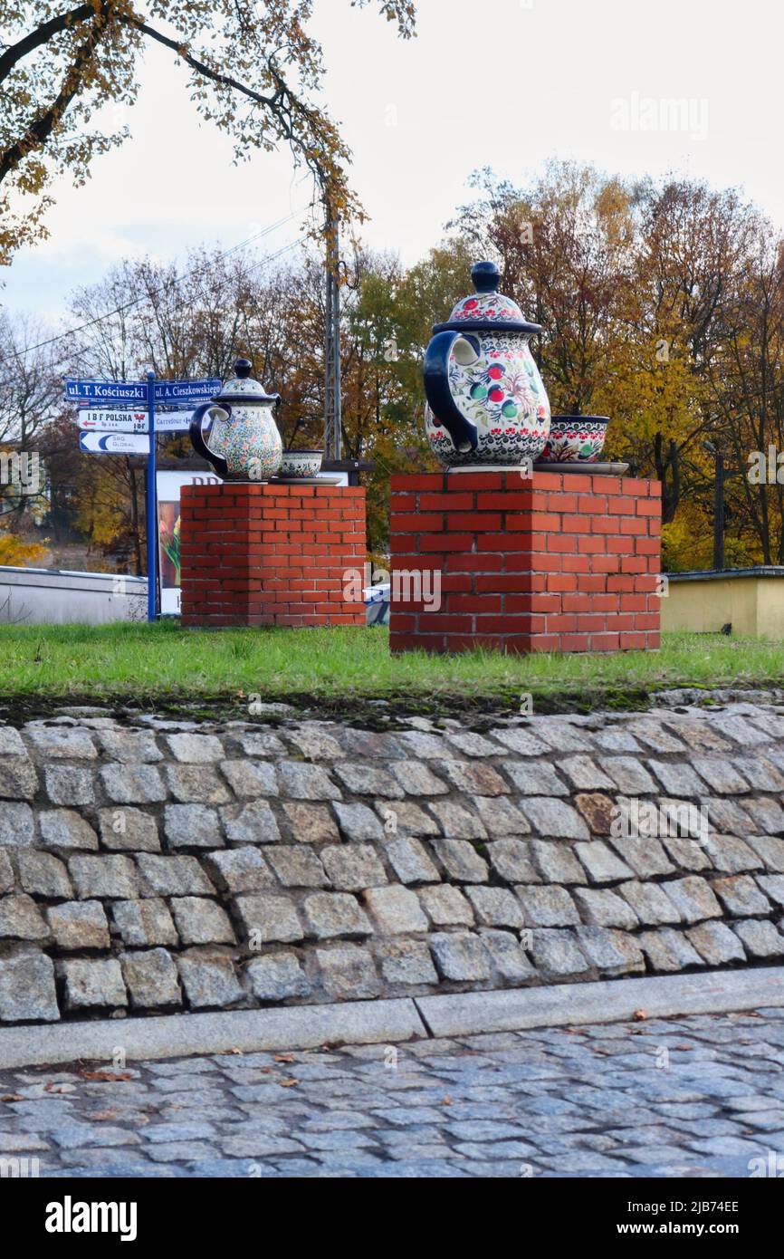 Tea pot and cup decorations in the middle of a roundabout in the Polish pottery town of Boleslawiec on a fall day in Poland. Stock Photo