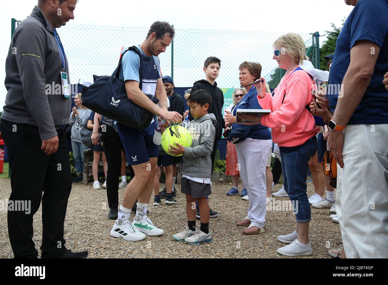 Andy Murray signs autographs after victory during day six of the