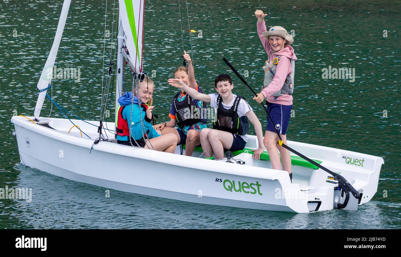 Children sailing a dinghy on holiday or vacation in RS Quest class dinghy. Stock Photo