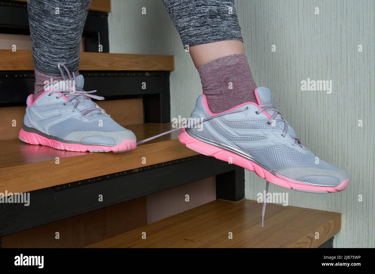 Woman untied shoes hi-res stock photography and images - Alamy