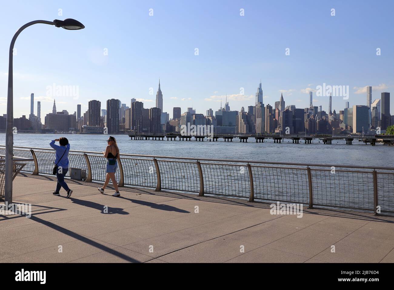 The pedestrian bridge in WNYC Transmitter Park with East River and