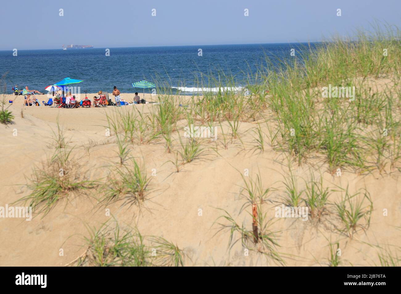 People relaxing on sand beach.Ocean Grove.New Jersey.USA Stock Photo