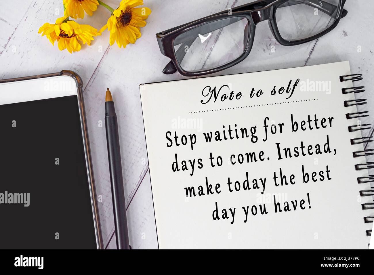 Motivational and inspirational quote on note book on wooden desk -Note to self, Stop waiting for better days to come, instead make today the best day Stock Photo