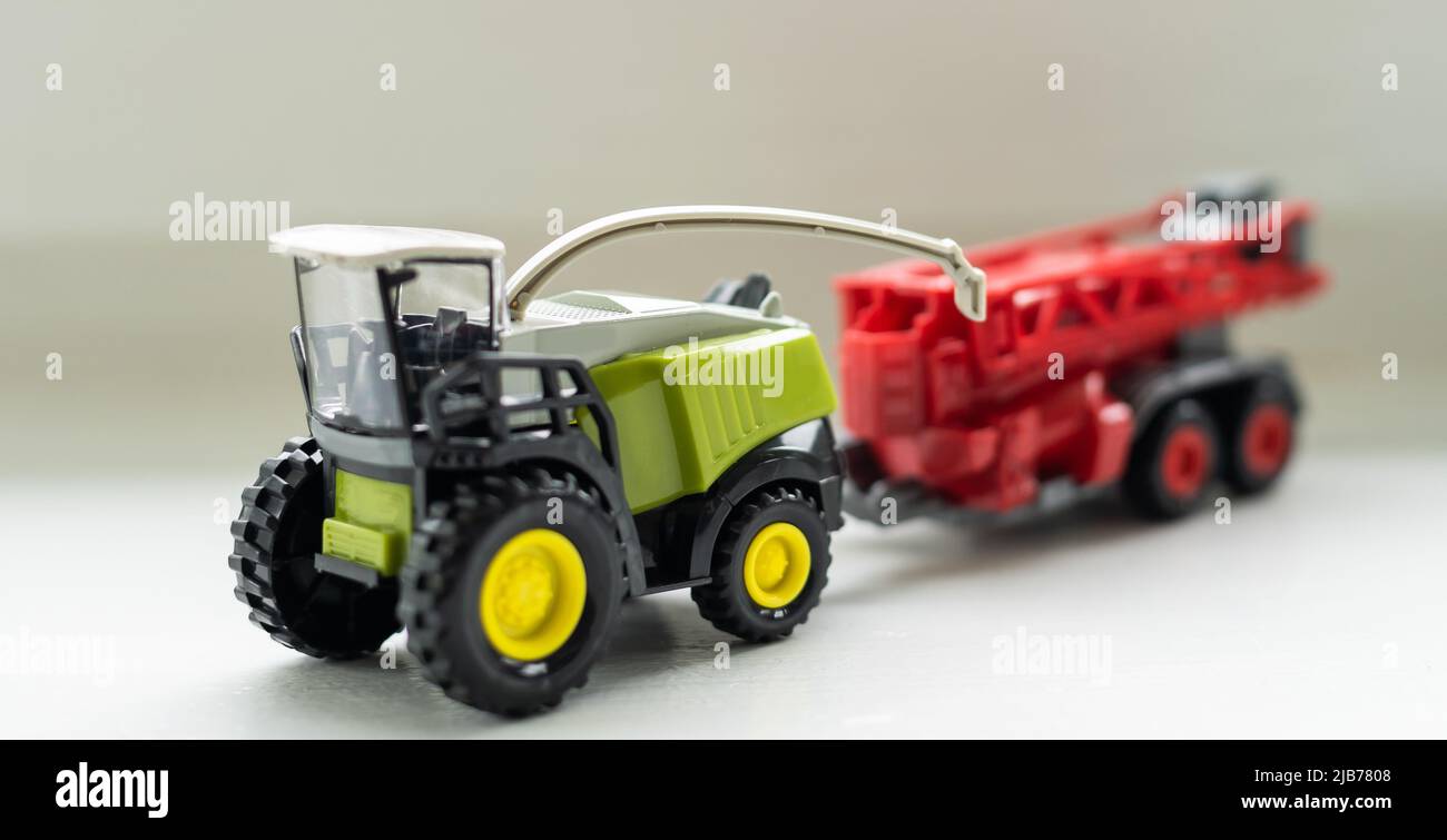 Toy Rice Harvester artificial tractor childrens' toy harvester Stock Photo - Alamy